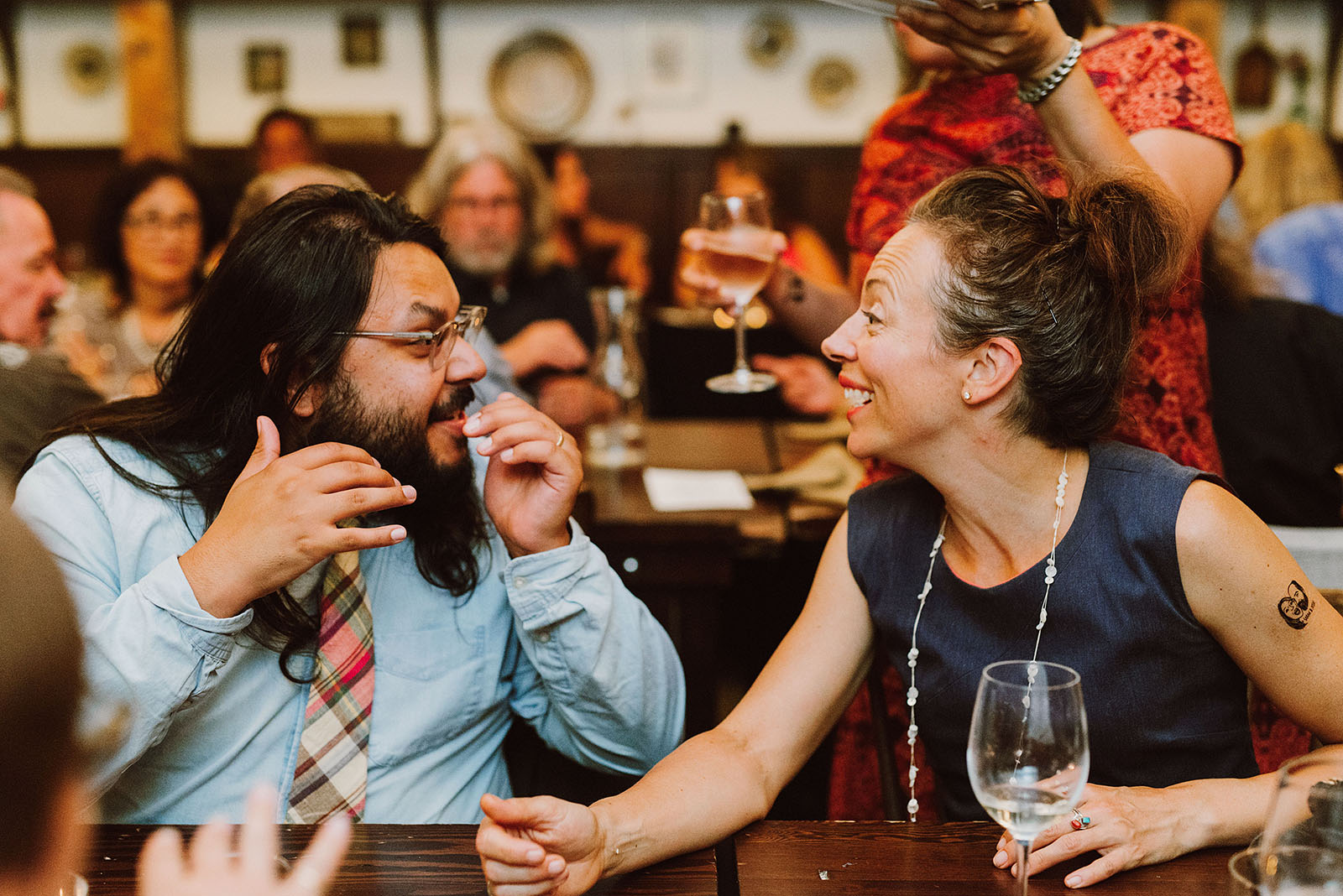 Wedding guests talking over dinner at an intimate Ned Ludd wedding
