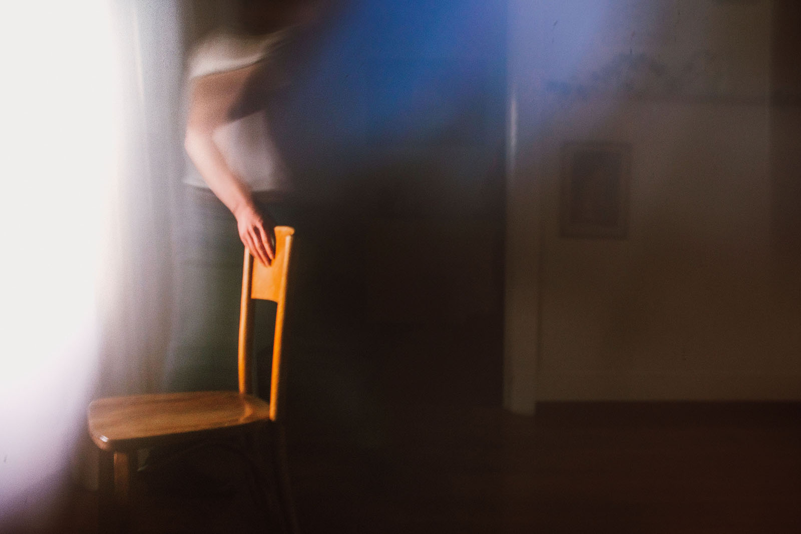 Ghostly photo of man moving chair - Portland Music Photographer