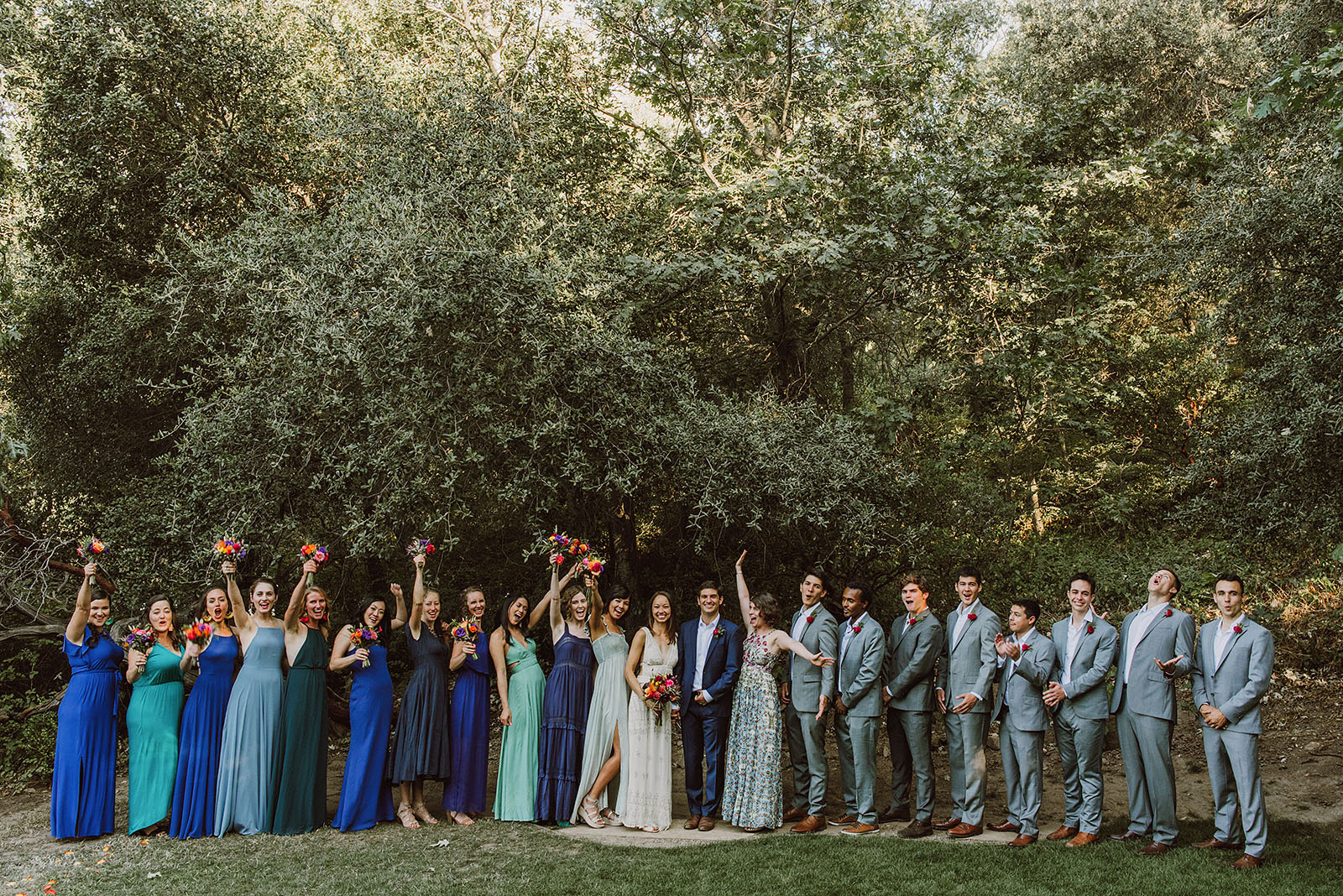 Group photo of couple and guests cheering at a Sacred Mountain Retreat Wedding