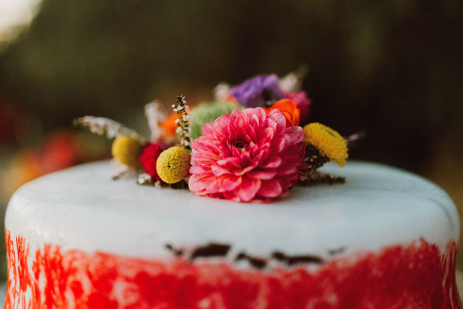 flowers on top of the cake at a Sacred Mountain Retreat Wedding