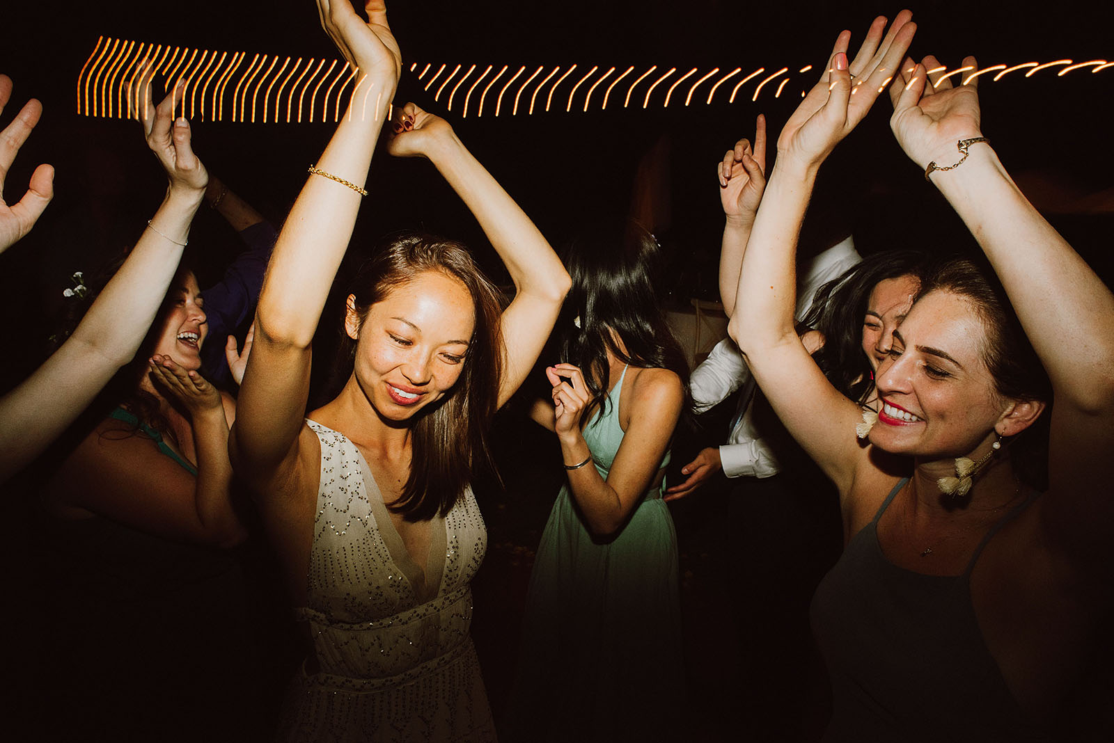 bride dancing with her bridesmaids at a Sacred Mountain Retreat Wedding