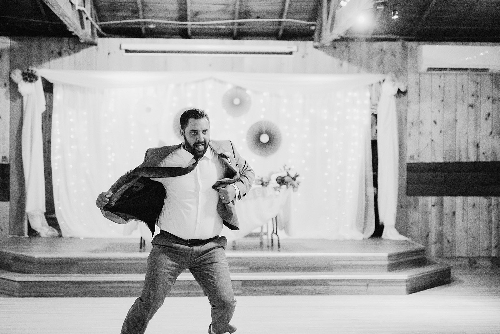 Groom getting wild on the dance floor at his Cedarville Lodge Wedding reception