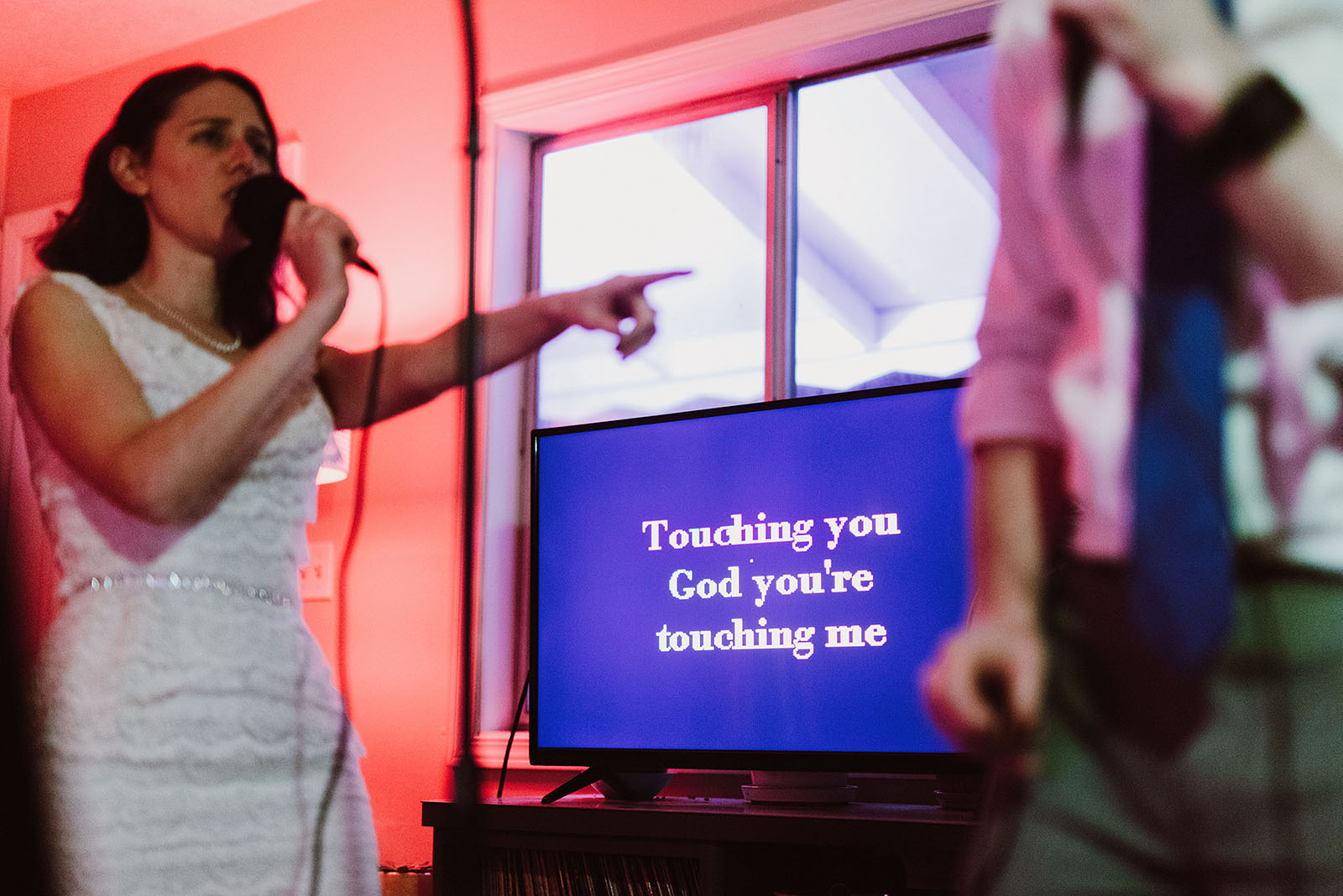 Bride and Groom doing wedding day karaoke together