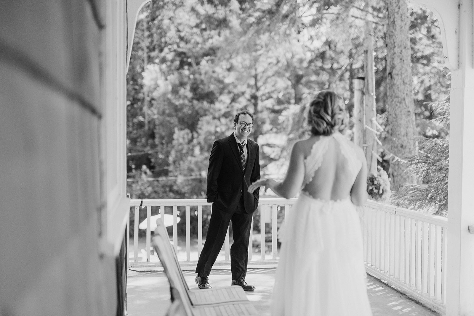 Groom's First Look with the Bride on the balcony at a SouWester Wedding in Seaview, WA