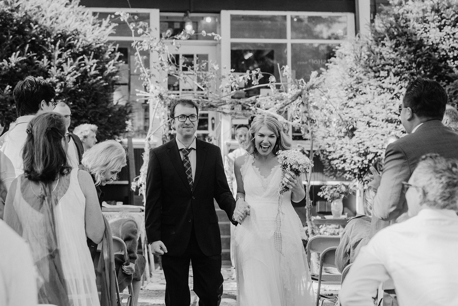 Bride and Groom walking down the aisle together at a SouWester Wedding in Seaview, WA