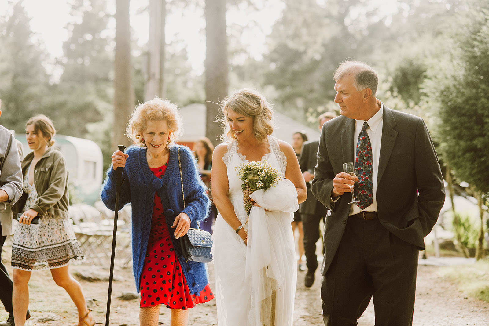 Bride and her family leaving cocktail hour at a SouWester Wedding in Seaview, WA