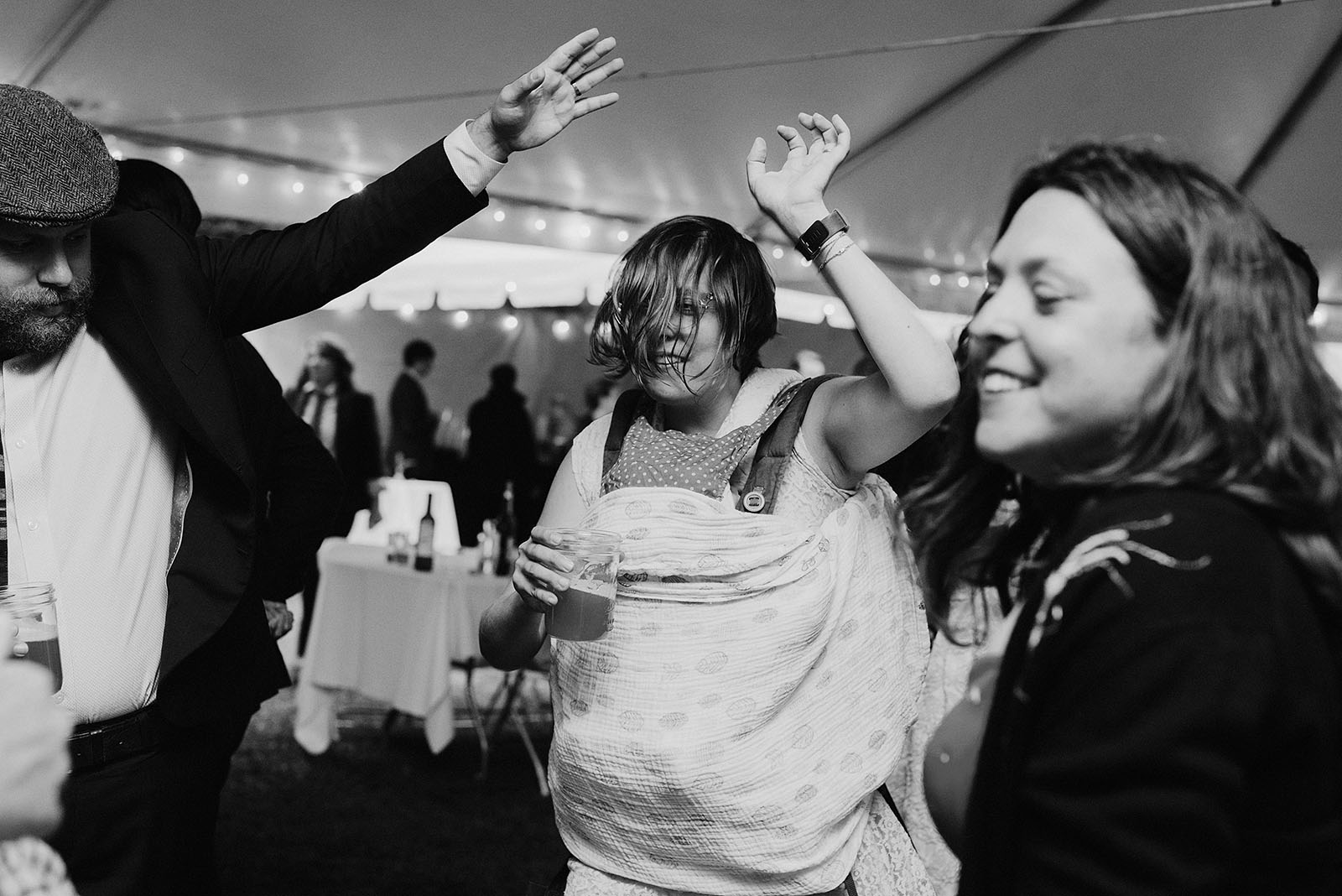 Guests dancing and drinking at a SouWester Wedding in Seaview, WA