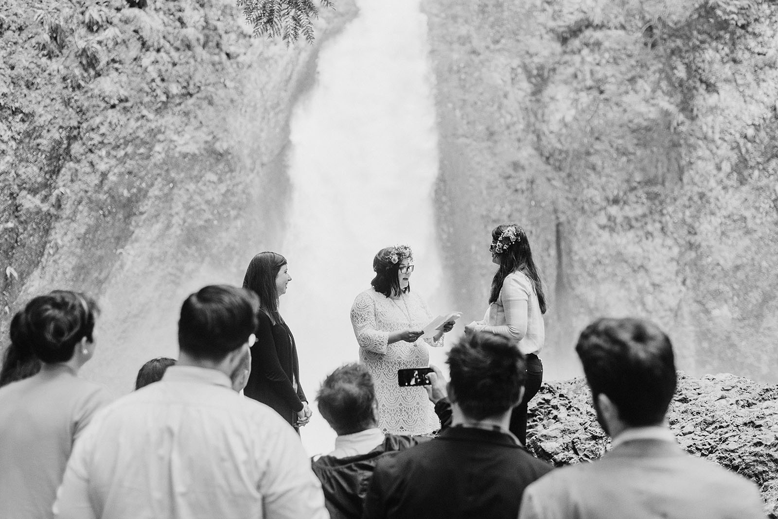 Wedding guests gathered around for the ceremony at a Portland waterfall elopement