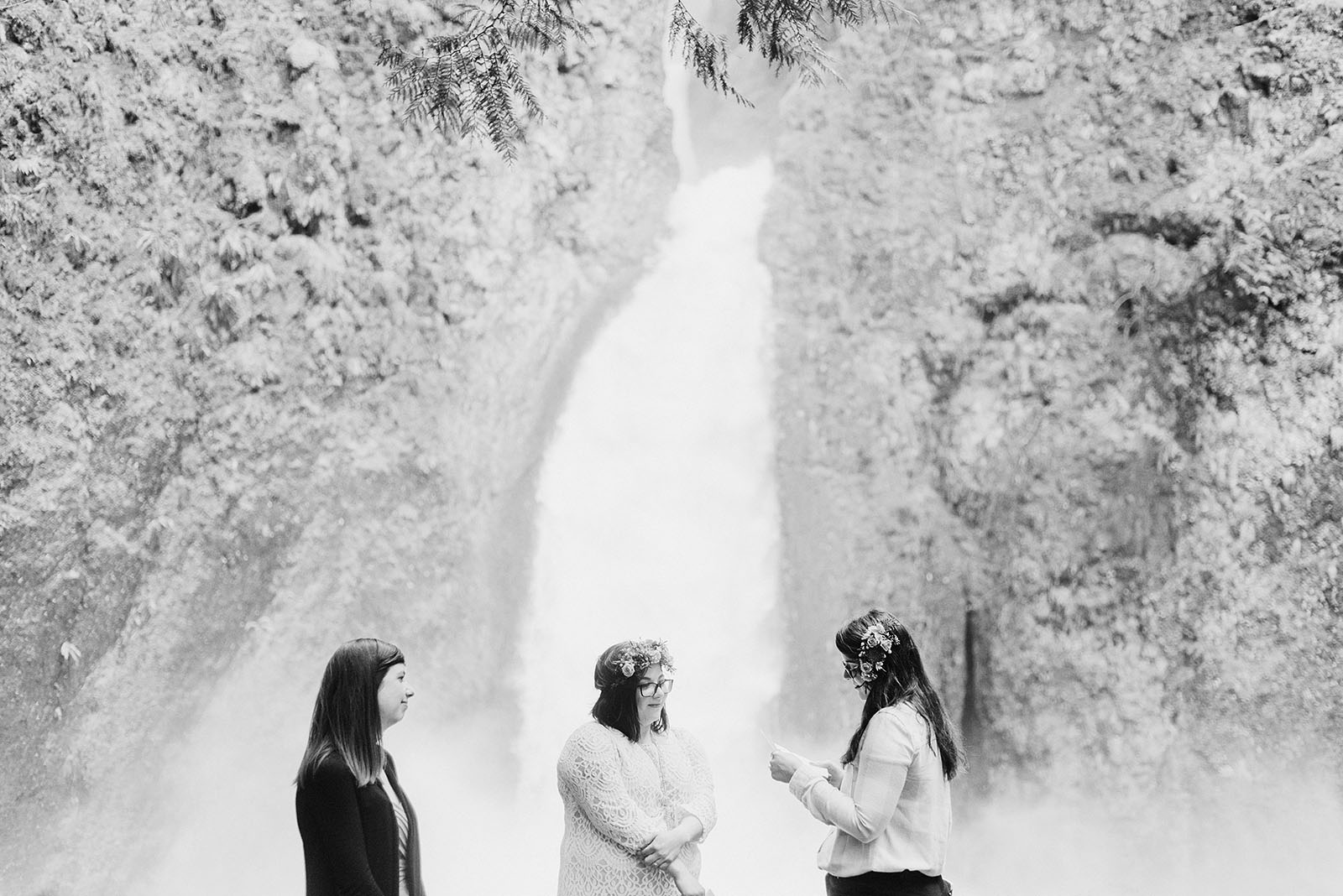 Brides exchanging vows at a Portland waterfall elopement