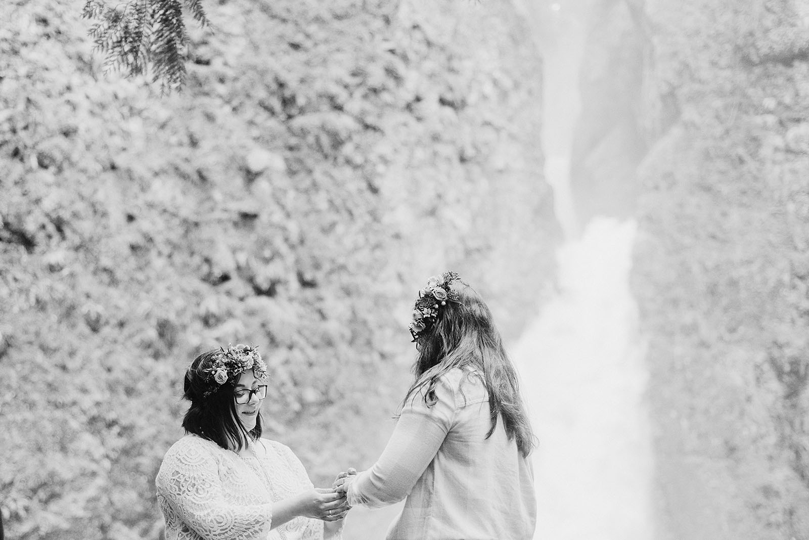 Brides exchanging rings at a Portland waterfall elopement