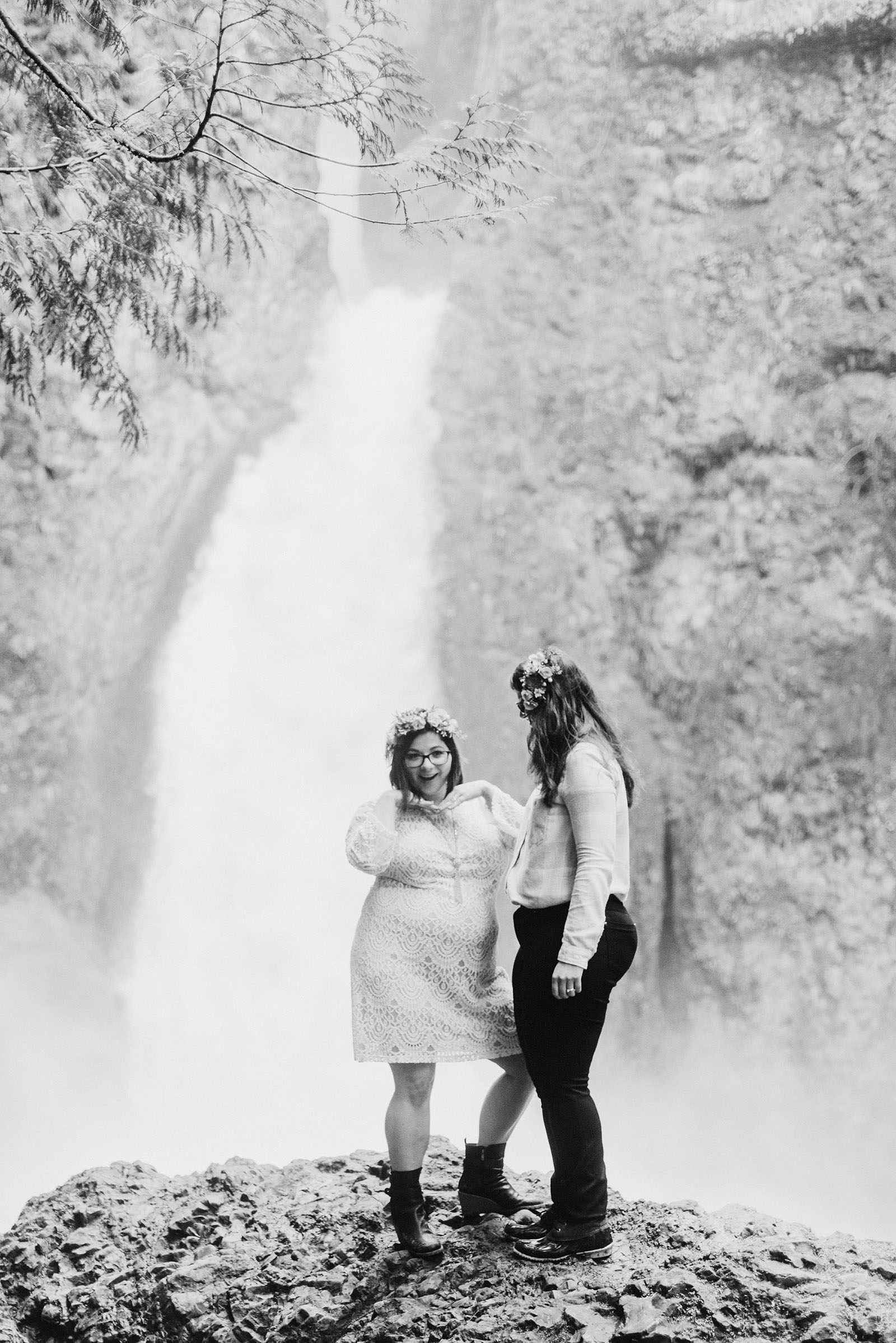 Brides goofing off in front of the camera at a Portland waterfall elopement
