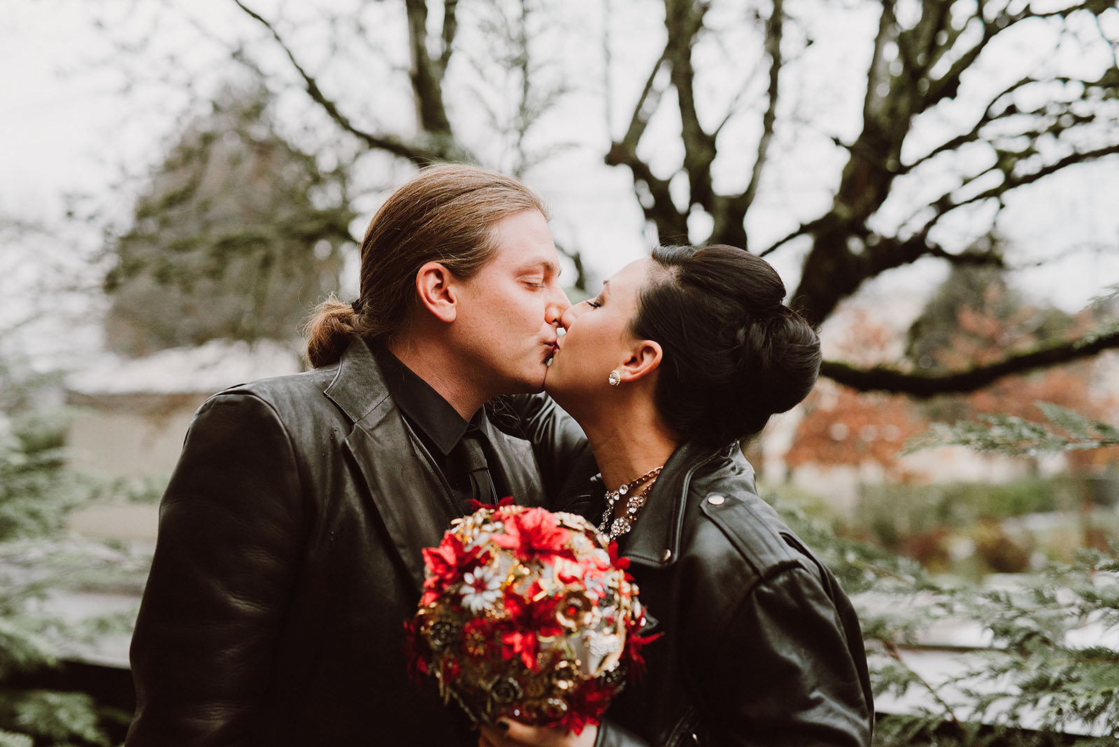 Bride and Groom kissing in the snow at The Colony St Johns Wedding