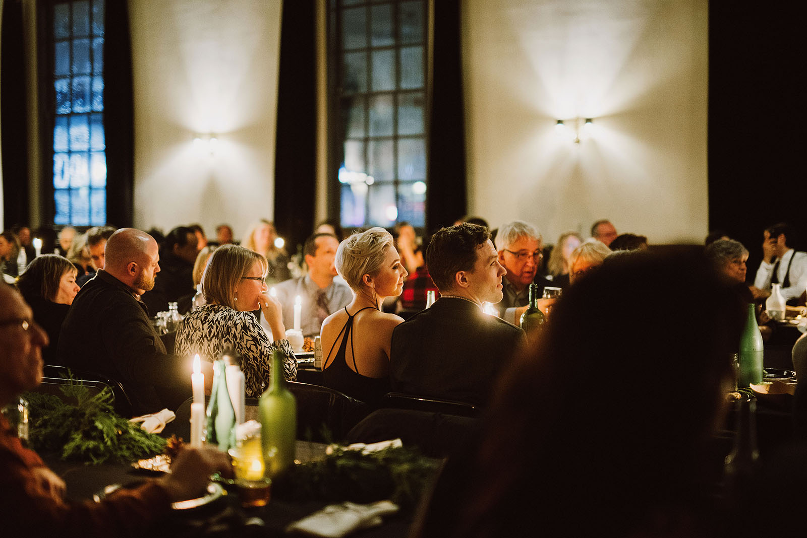 Guests listening to toasts during dinner at The Colony St Johns Wedding