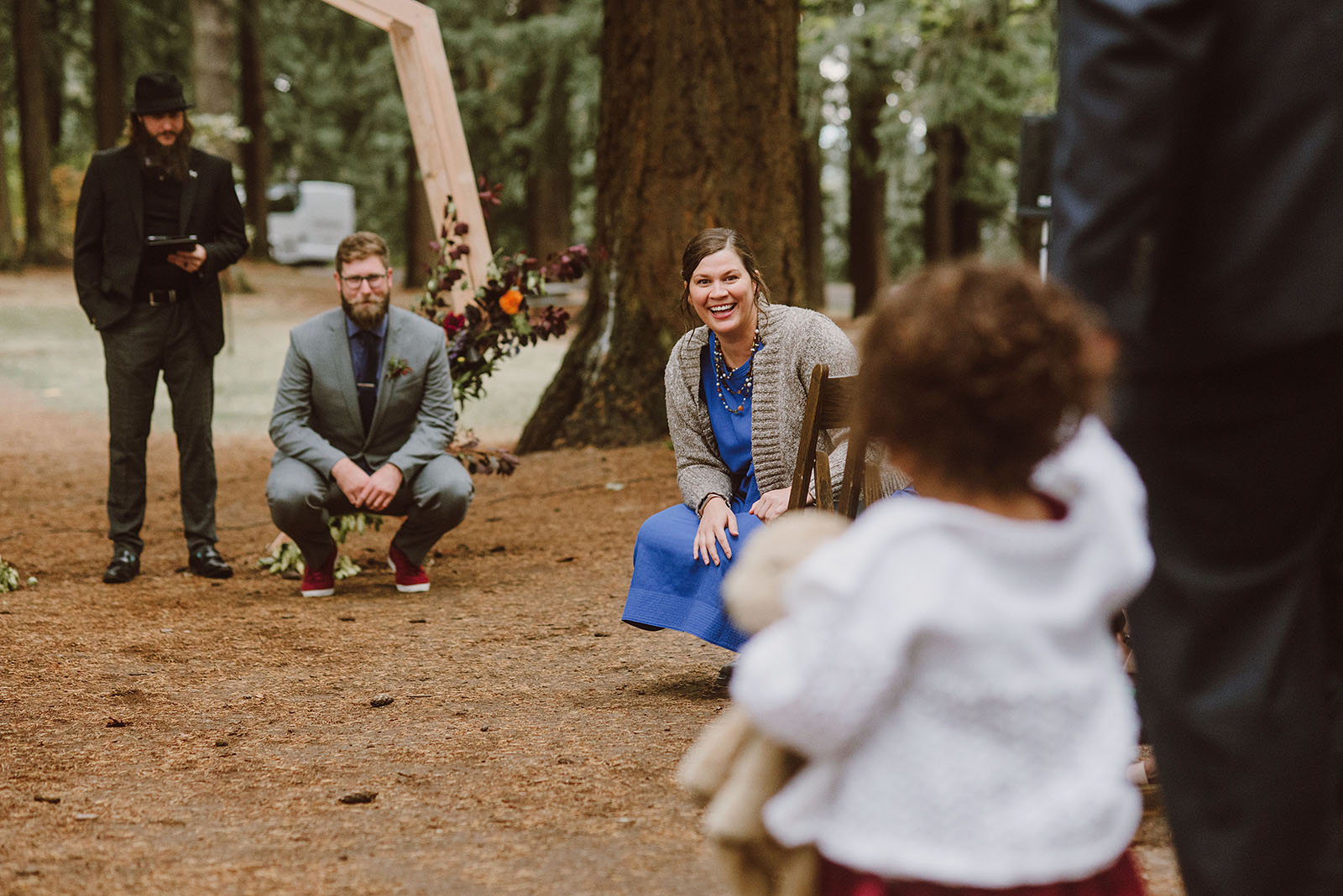 flower girl walking down the aisle on Mt Tabor - portland wedding photography