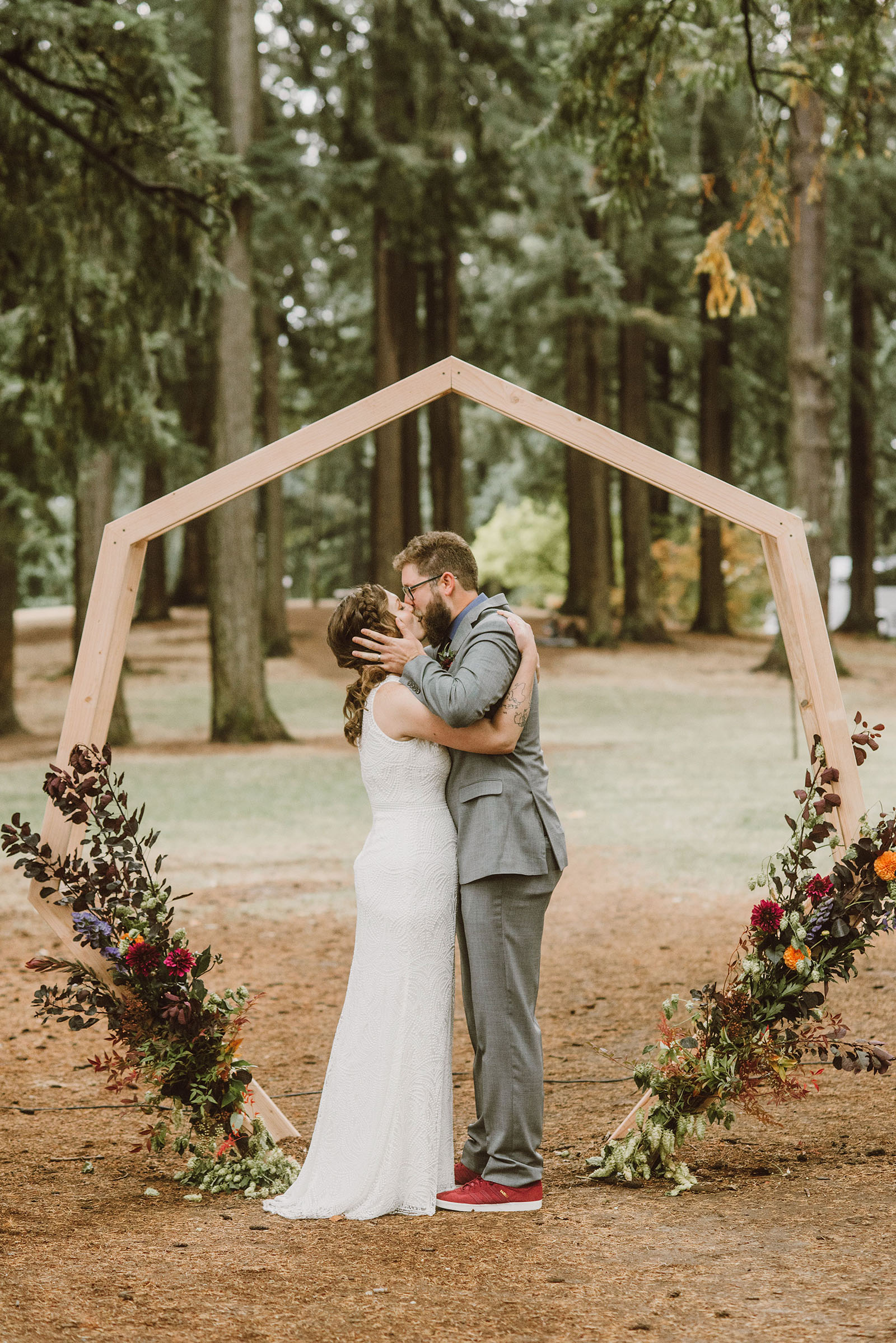 bride and groom kissing after ceremony on Mt Tabor - portland wedding photography