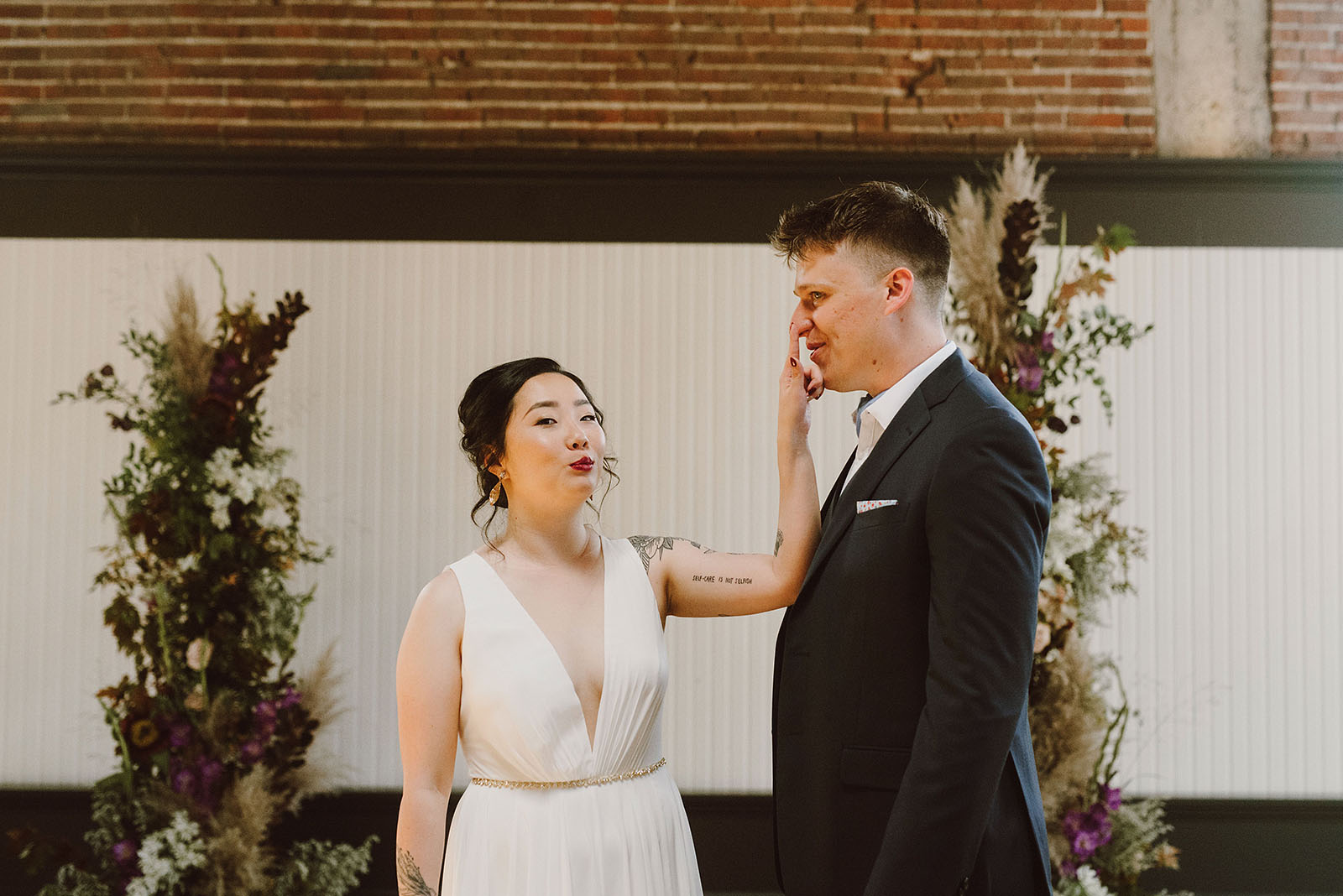 bride and groom being silly at the Evergreen - portland wedding photography