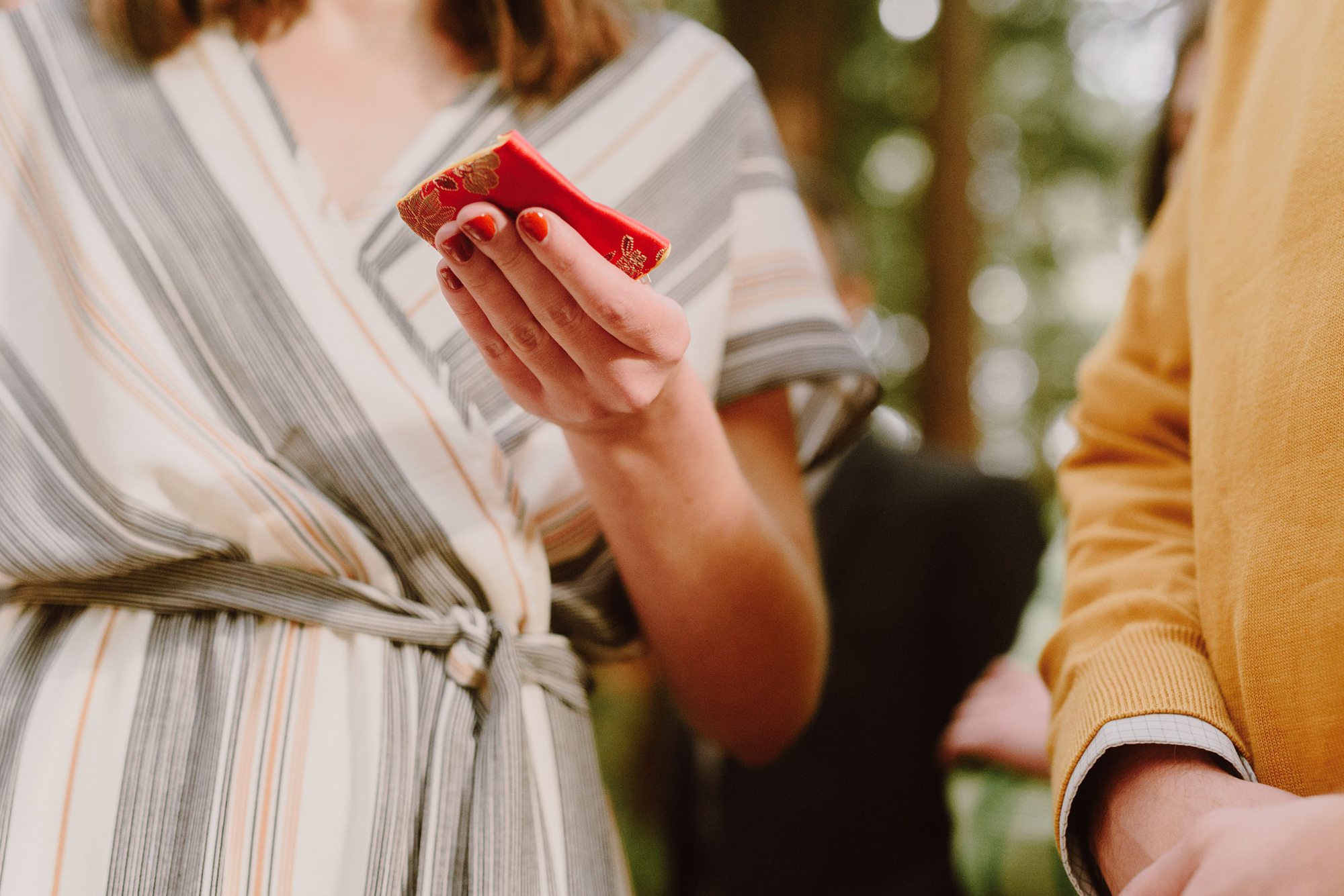 Wedding guests blessing rings during the ceremony