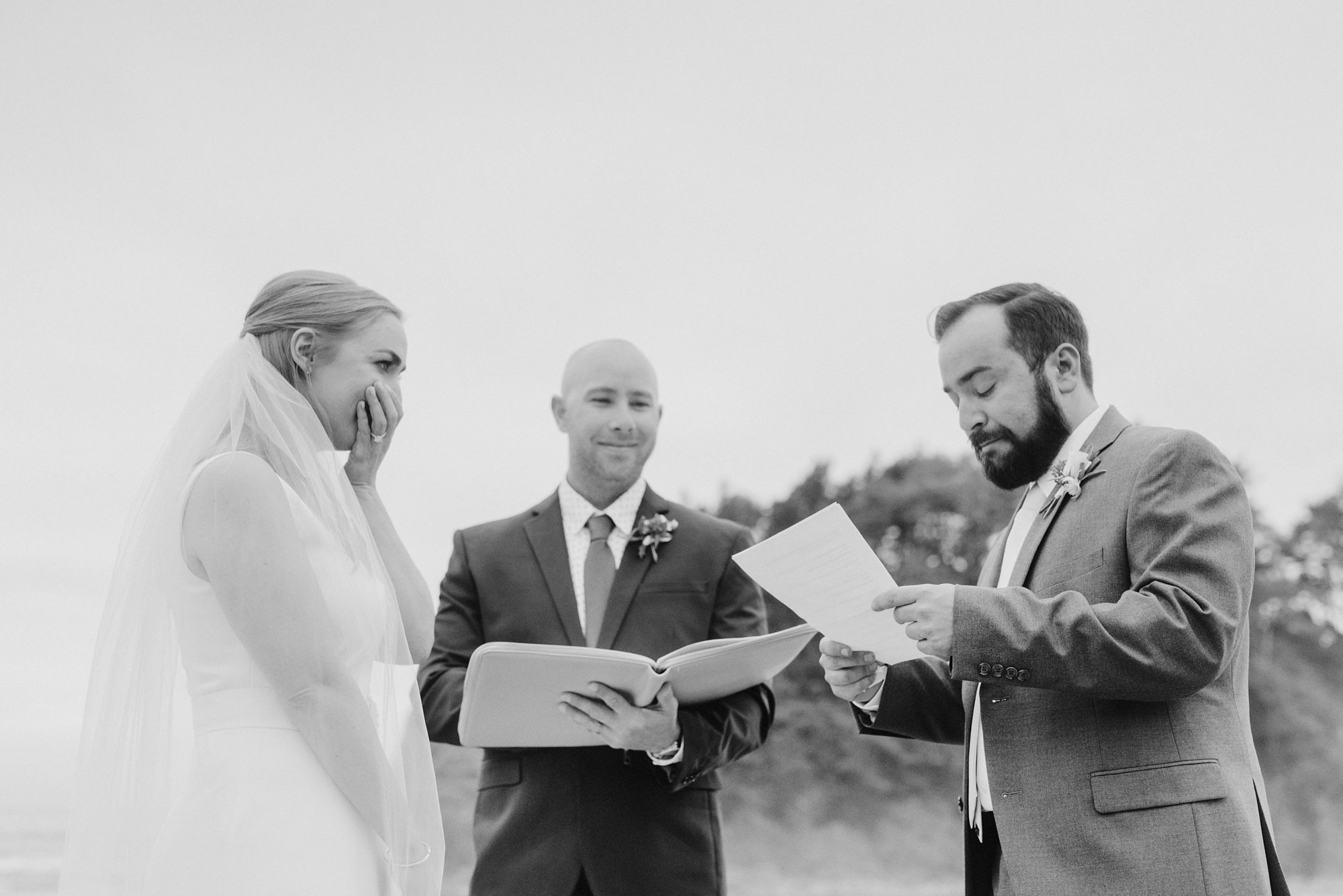 Emotional vow exchange during a wedding ceremony on the Oregon Coast | Portland Wedding Photographer