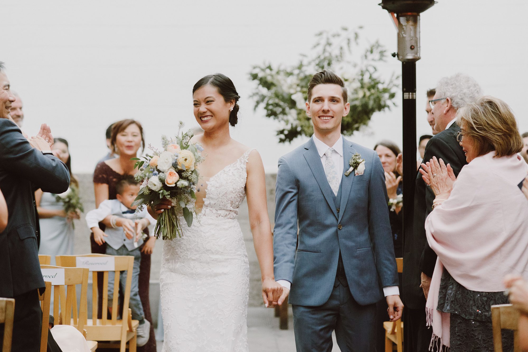 Bride and Groom walking down the aisle together | San Francisco Wedding Photographer