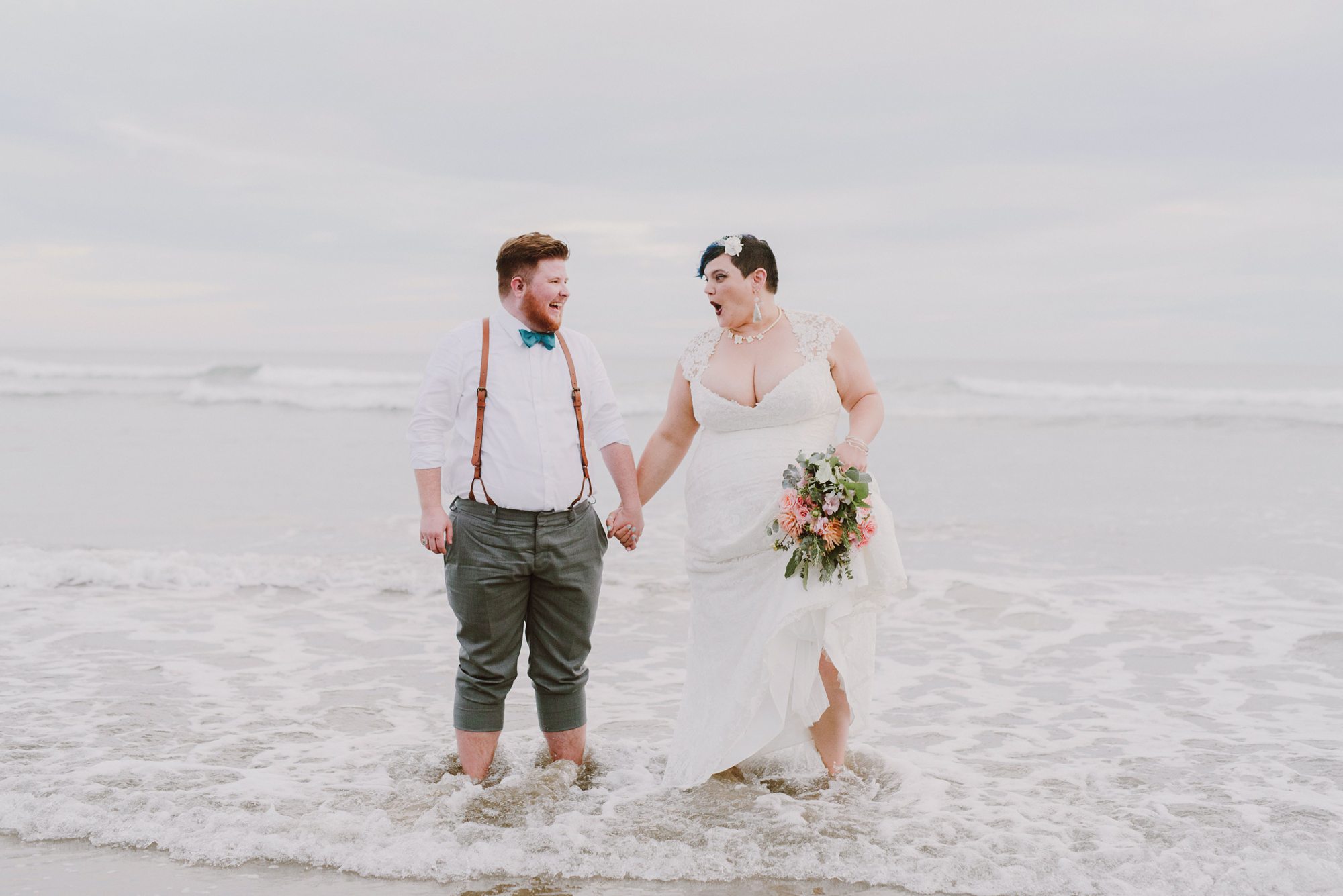 Newlyweds standing in ocean water | Queer Love | Portland Wedding Photographer