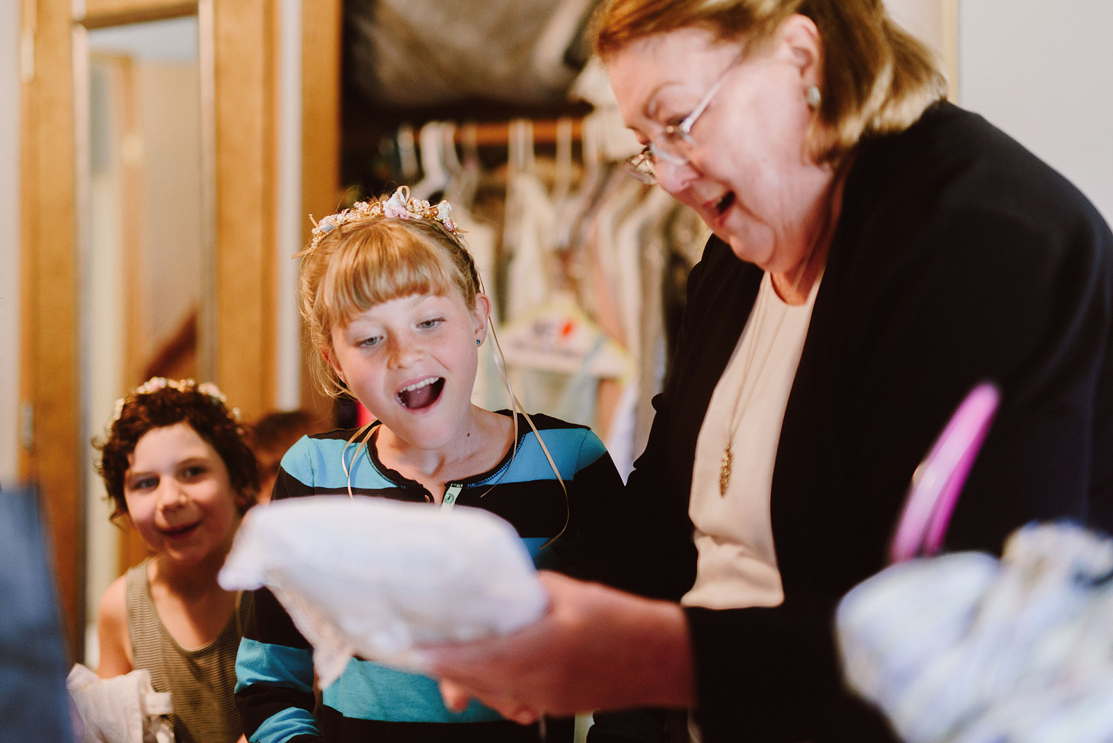 Grandmother showing off the ring bearer's pillow to the flower girls - Columbia River Gorge wedding