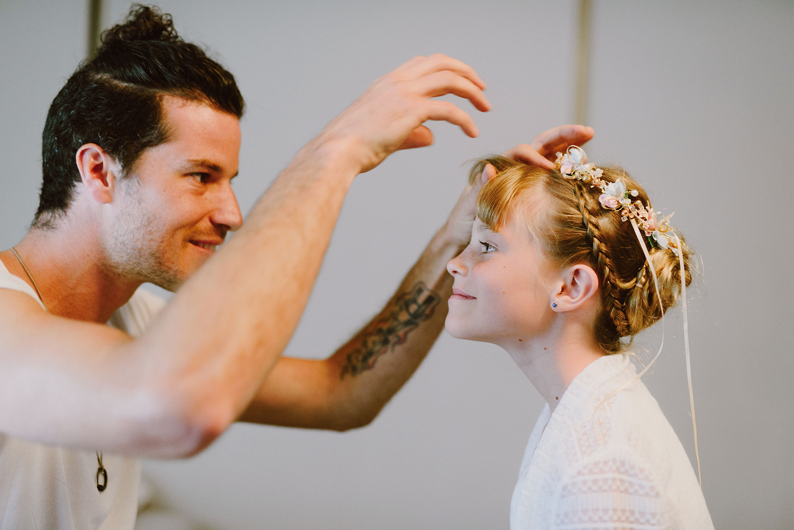Groom putting flower crown on his daughter - Columbia Gorge River Wedding in Oregon