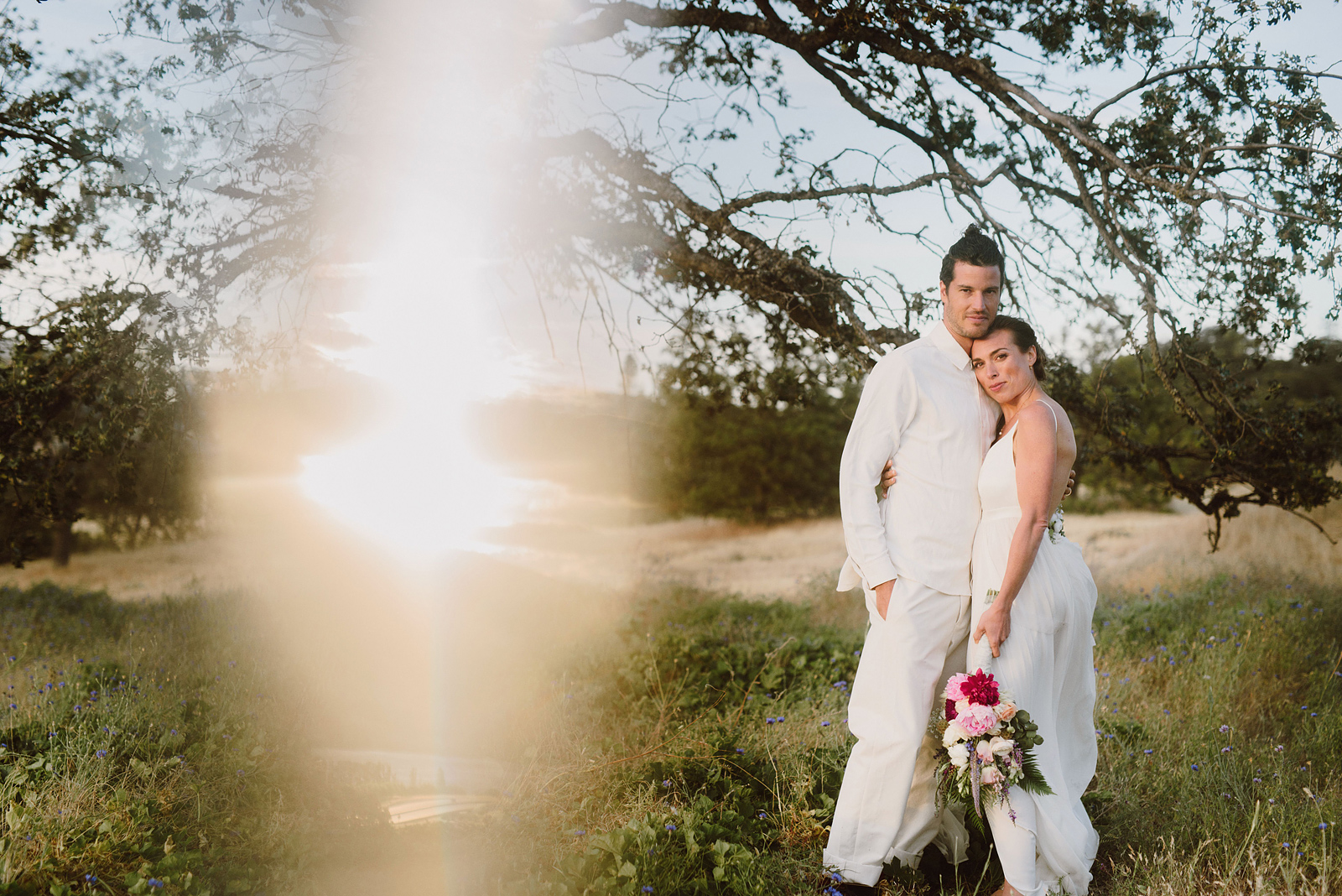 Prism photo of a bride and groom cuddling in the golden hour at a Columbia Gorge River Wedding in Oregon