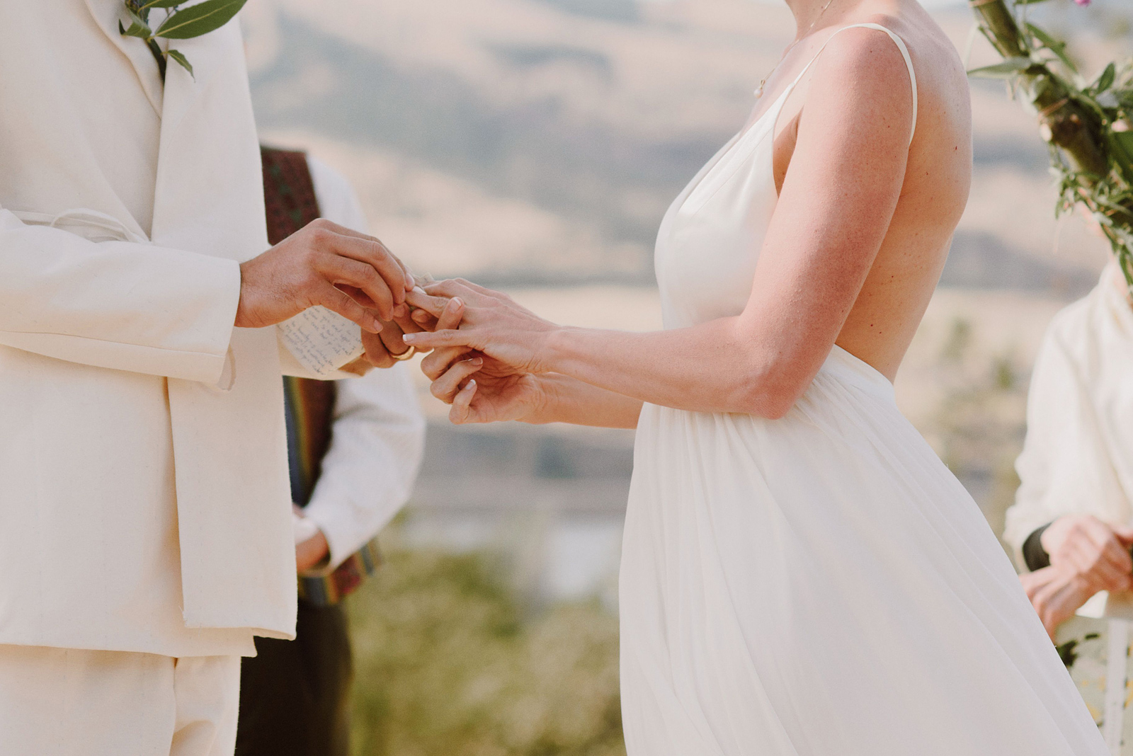 Couple exchanging rings at a Columbia Gorge River Wedding in Oregon