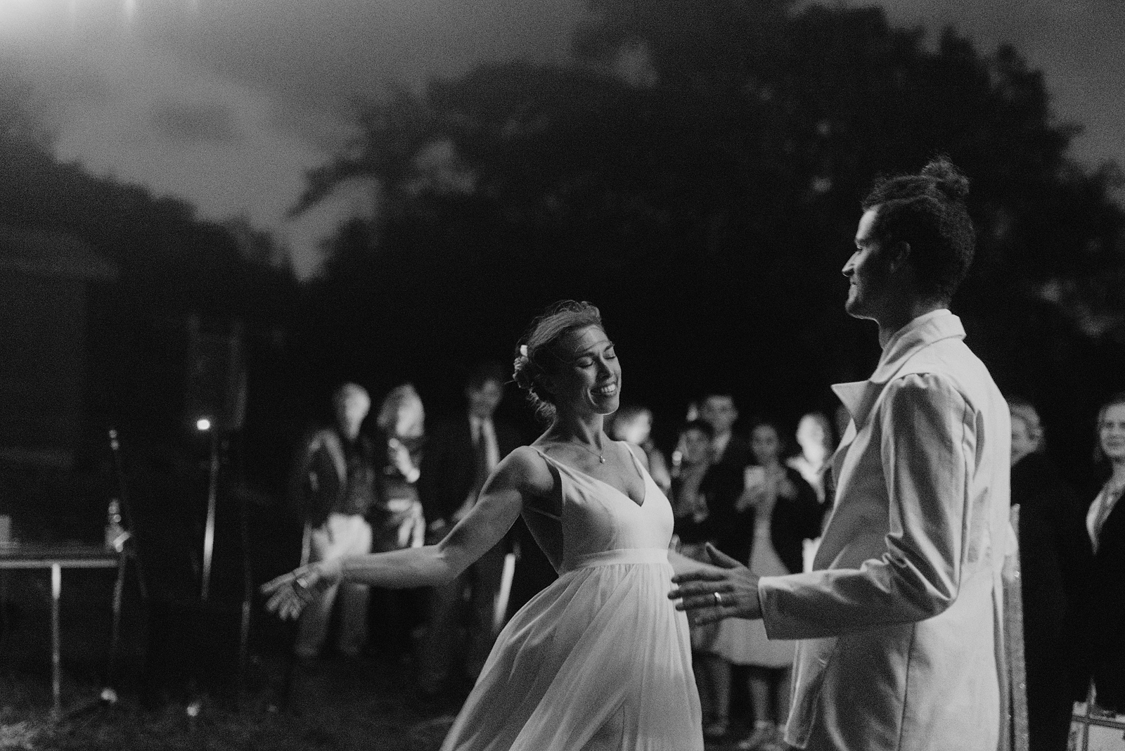 Black and white portrait of bride dancing towards the groom - Columbia Gorge River Wedding Reception