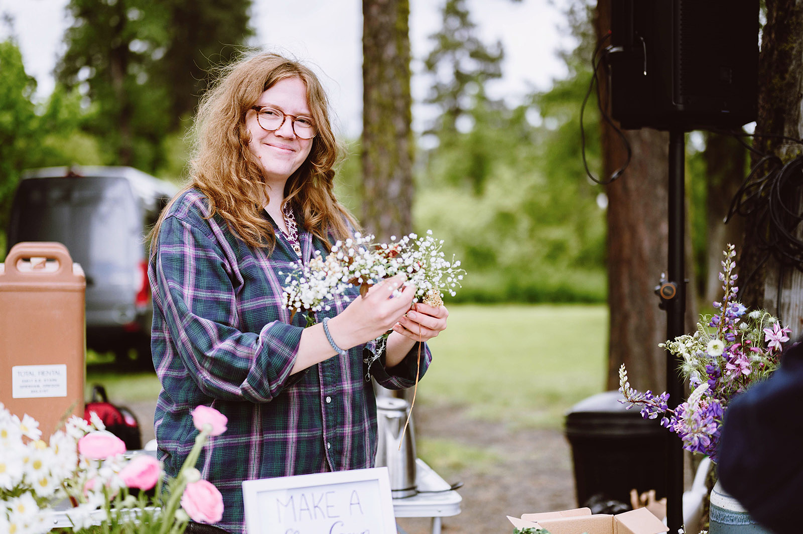 Woman making a flower crown at a Trout Lake Wedding in Washington