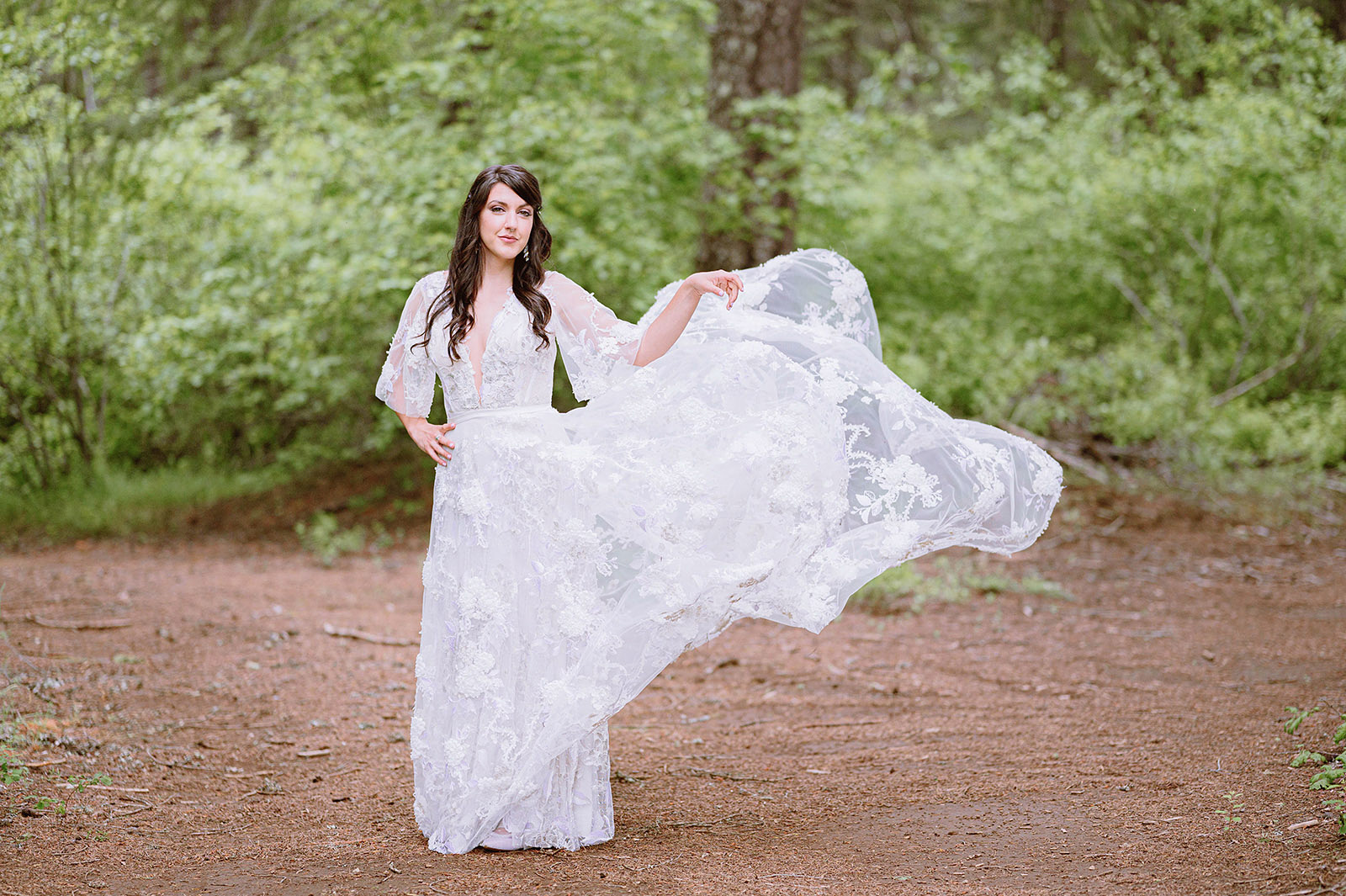 Portrait of witch bride magically lifting her dress in the air - Trout Lake Wedding, WA