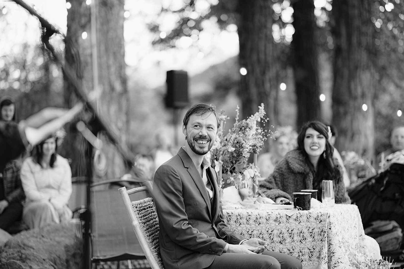 Groom smiling while toasts are being read at the reception in Hollenbeck Park - Trout Lake Wedding, WA