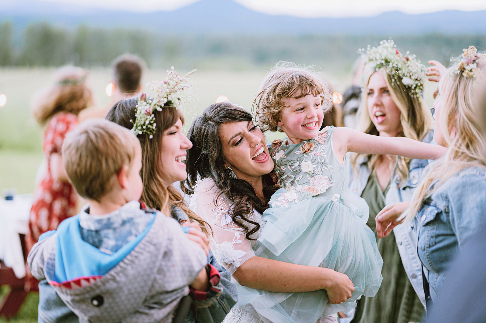 Bride being surrounded by her sisters on the dance floor at Hollenbeck Park - Trout Lake Wedding, WA