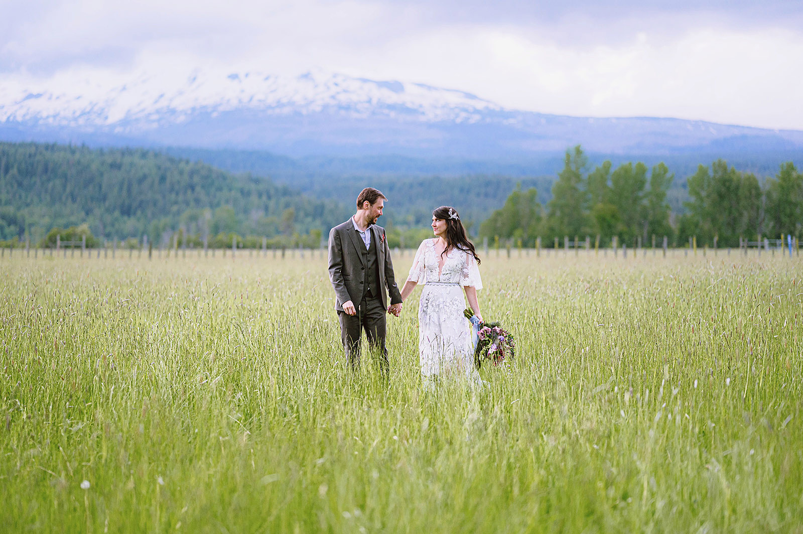 Portrait of bride and groom standing in tall grass at Hollenbeck Park - Trout Lake Wedding, WA