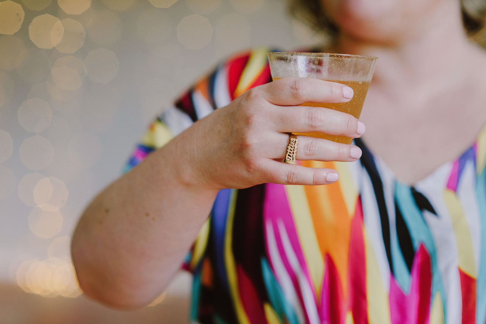 Close-up of bride's ring which says Titties in cursive - Oaks Pioneer Church Wedding