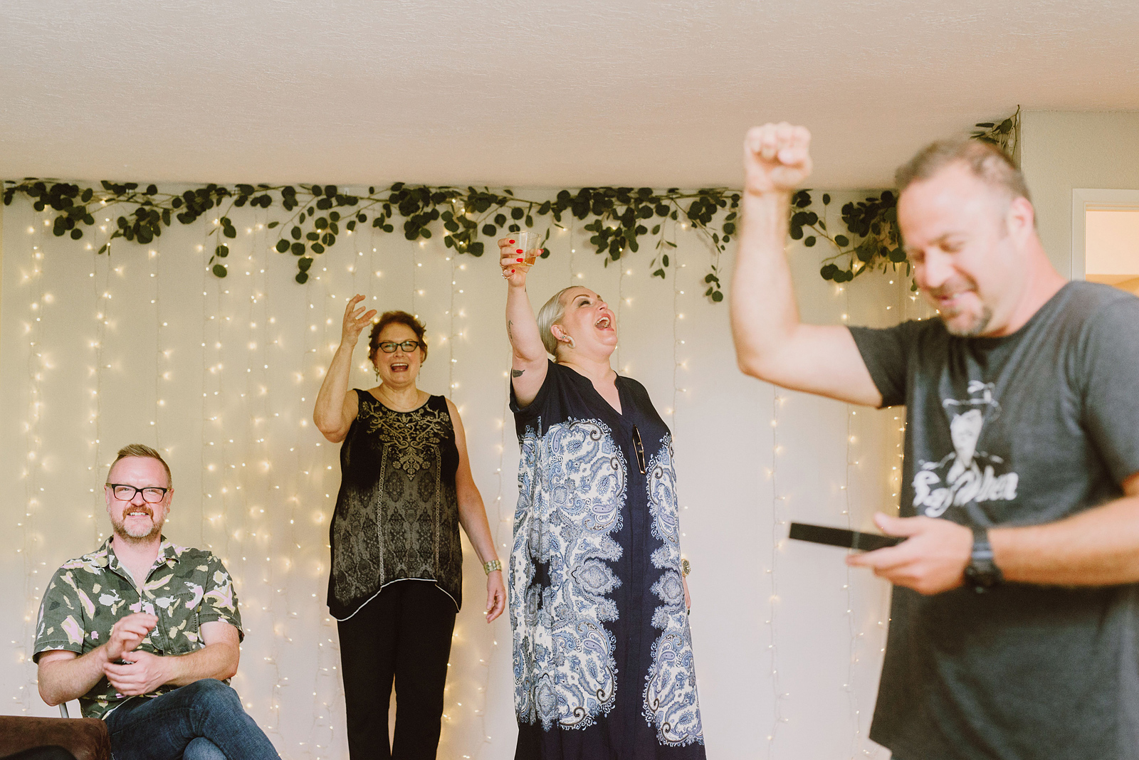 Guests cheering during toasts at the afterparty - Oaks Pioneer Church Wedding