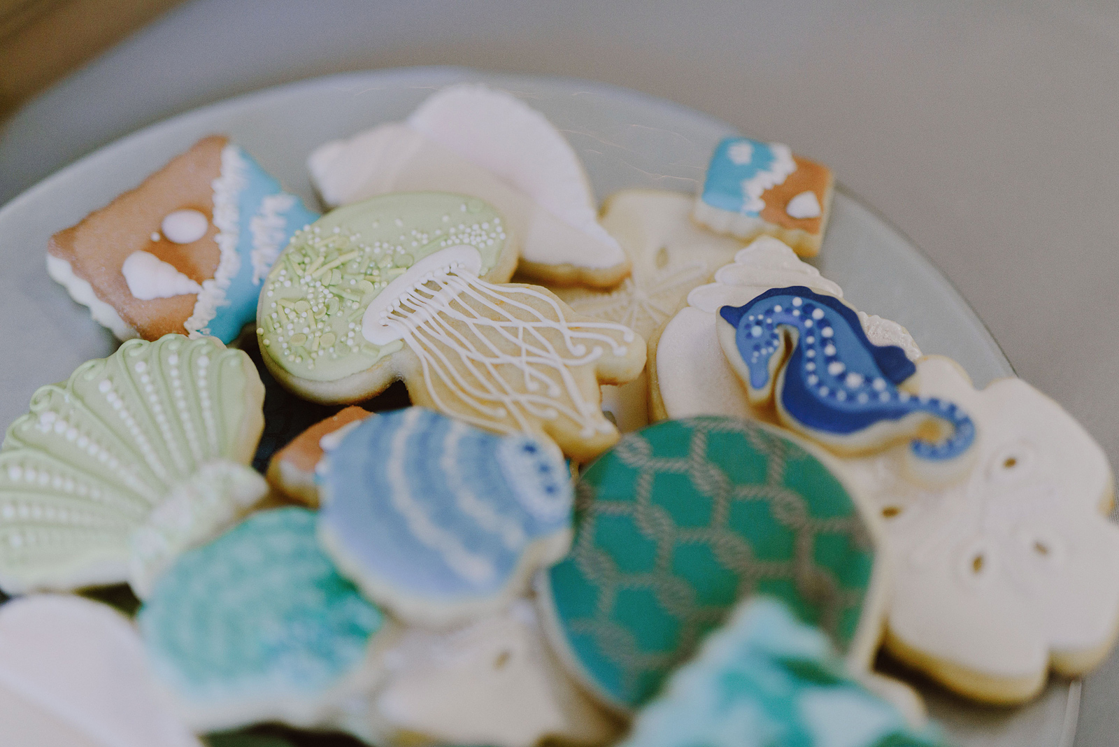 Wedding favor cookies in the shape of seashells, jellyfish and seahorses - Oceanside Community Club Wedding on the Oregon Coast” title=